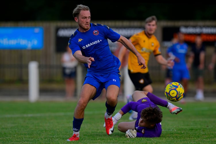 Goal celebrations for Harvey Greenslade of Truro City as he goes around Morgan Jones, Goalkeeper of Falmouth Town to score a goal during the Pre Season Friendly match between Falmouth Town and Truro City at Bickland Park, Falmouth on 10 July 2026 (Photo: Tom Sandberg/PPAUK)