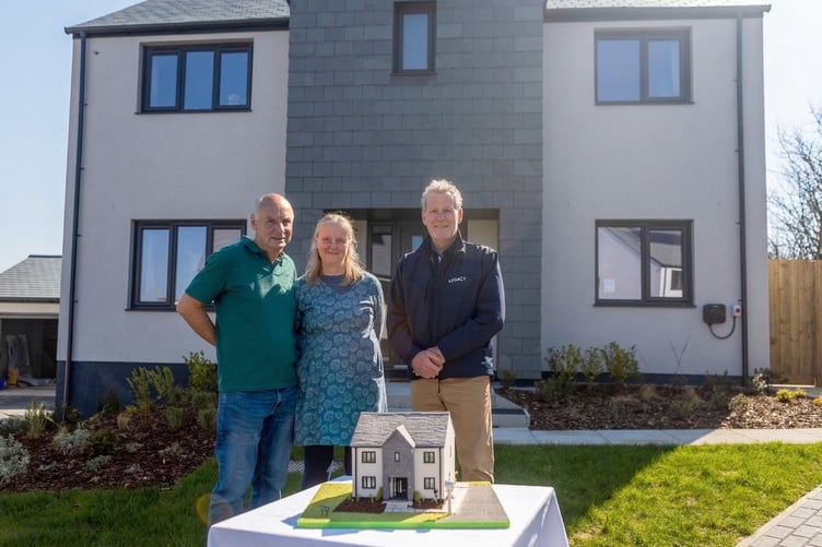 Cornish housebuilder, Legacy Properties, celebrated its 250th home by gifting an incredible replica house cake to its new homeowners at one of their latest developments in Bude. Pictured are Geoff and Sally Cox with Mark Docherty from Legacy Properties and the cake replica