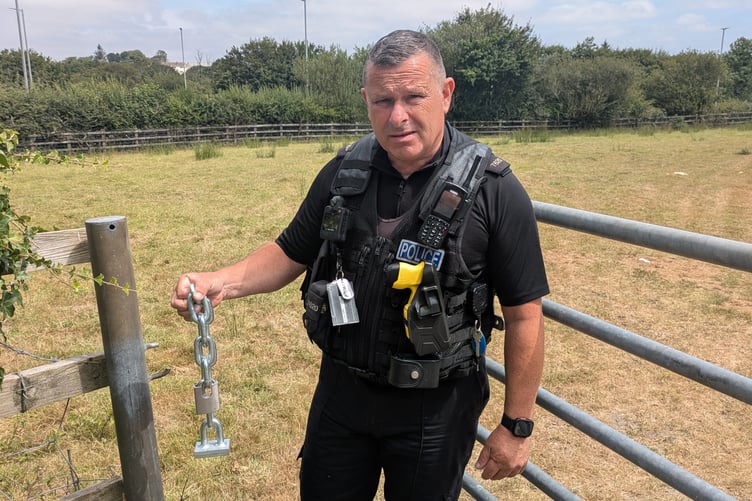 PC Jim Eagles, the neighbourhood beat officer for St Columb with the chain the thieves cut to gain entry into the field (Picture: Warren Wilkins)