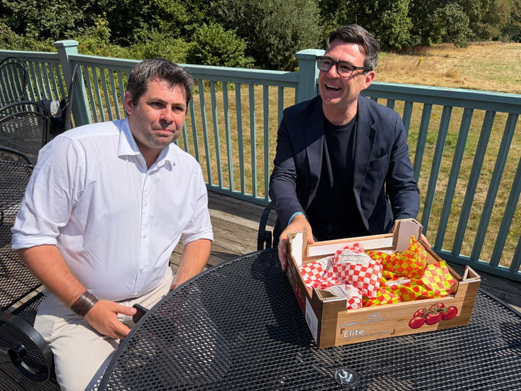 Cllr Leigh Frost presents Andy Burnham with a box of Barnecutts pasties at The Arborist cafe