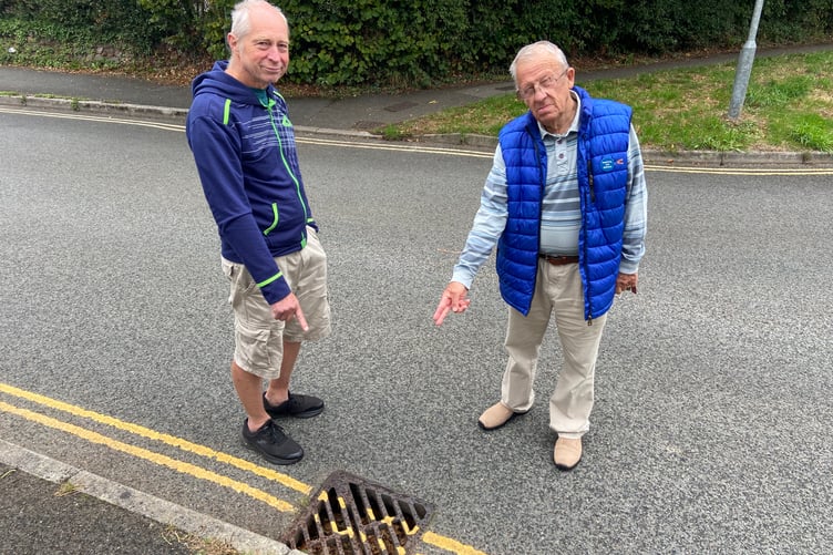 Stourscombe estate residents Paul Jones (left) and Les Whaley are deeply concerned by the state of Stourscombe's sewage pipes and storm drains - with both blocking easily and causing concern a 'river of sewage' running down the street is an "inevitability"