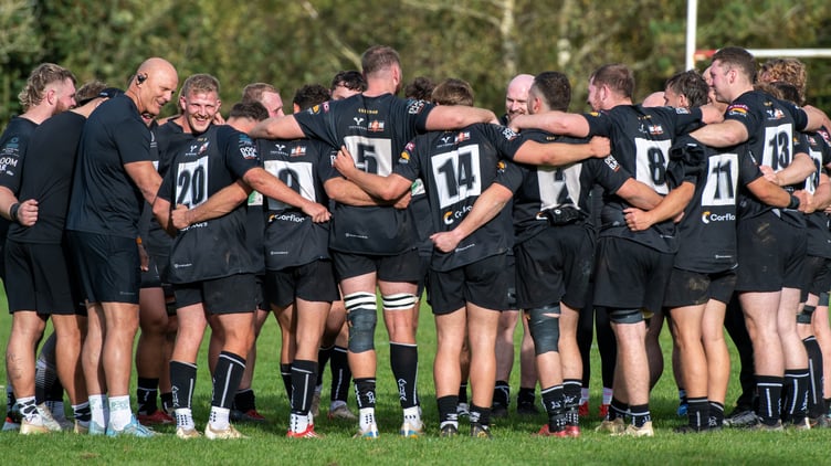 Launceston's players and coaches were all smiles in their post-match huddle.