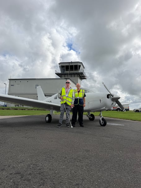 When Michael [left] took to the skies he was given the opportunity to take the controls and fly this light aircraft over Padstow and Port Issac under the watchful eye of his instructor Michael Owen [right]