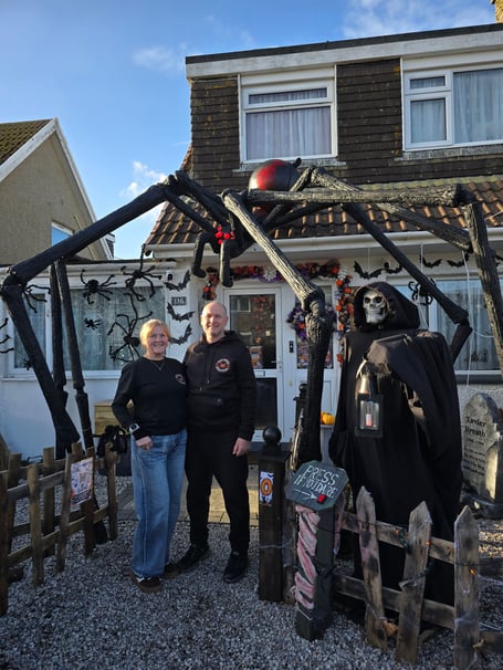 Jo and Nick Phelps at their Boslowick Road home in Falmouth with 'FANG' in all her bone-chilling glory having been resurrected after the recent onslaught of storms tore her apart - threatening the highly anticipated display